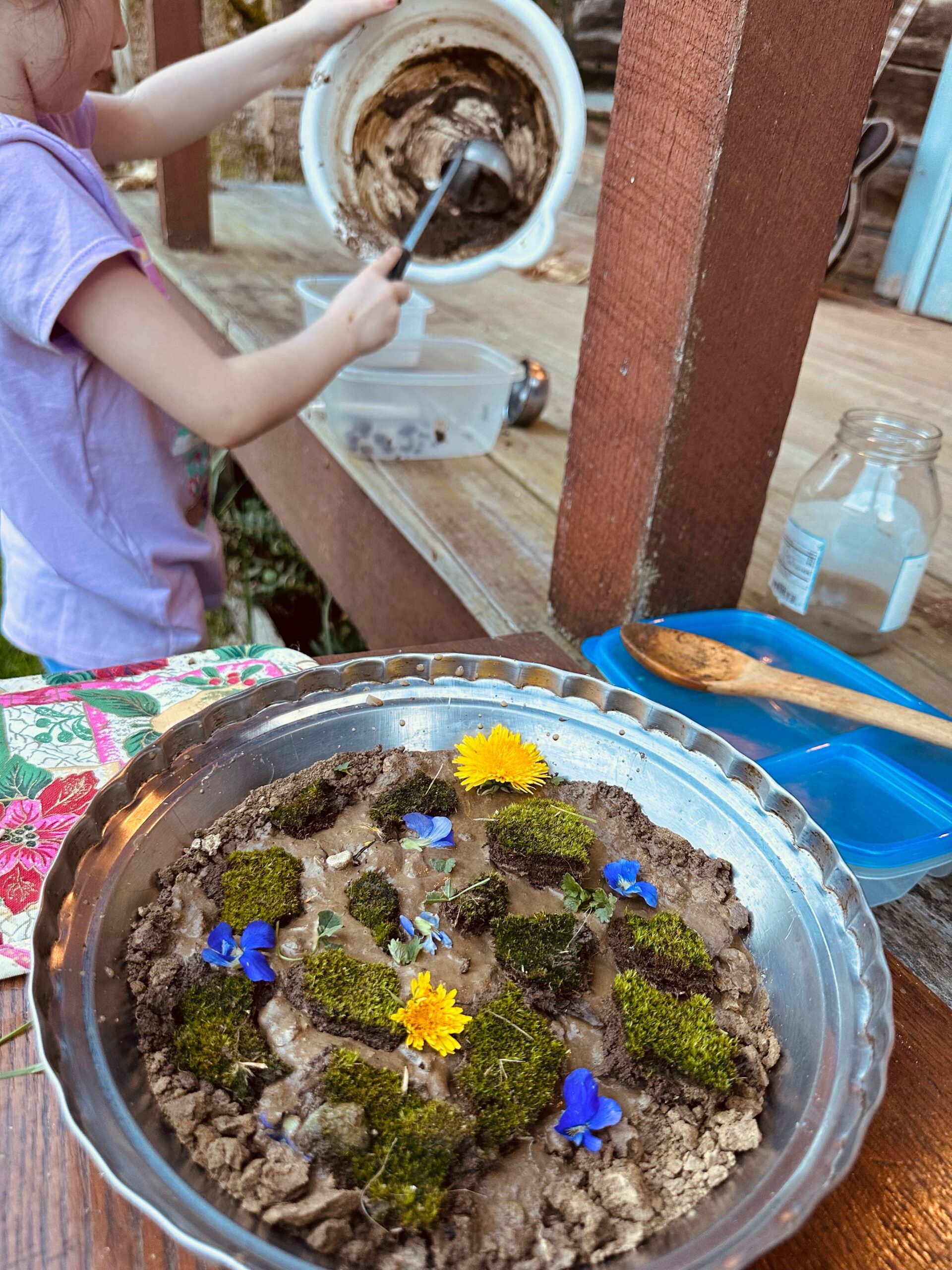 child making a mud pie